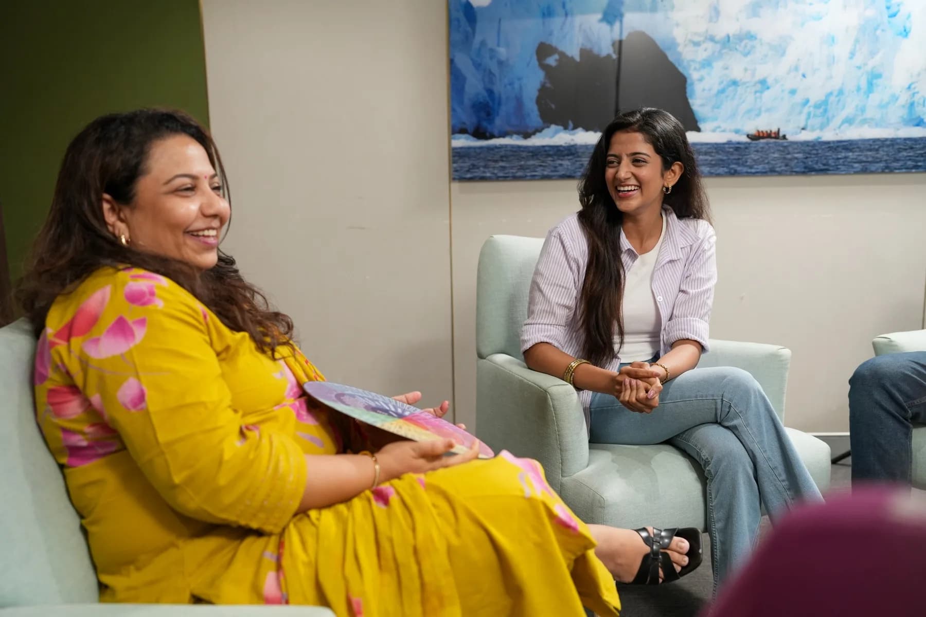 Two participants in conversation during group