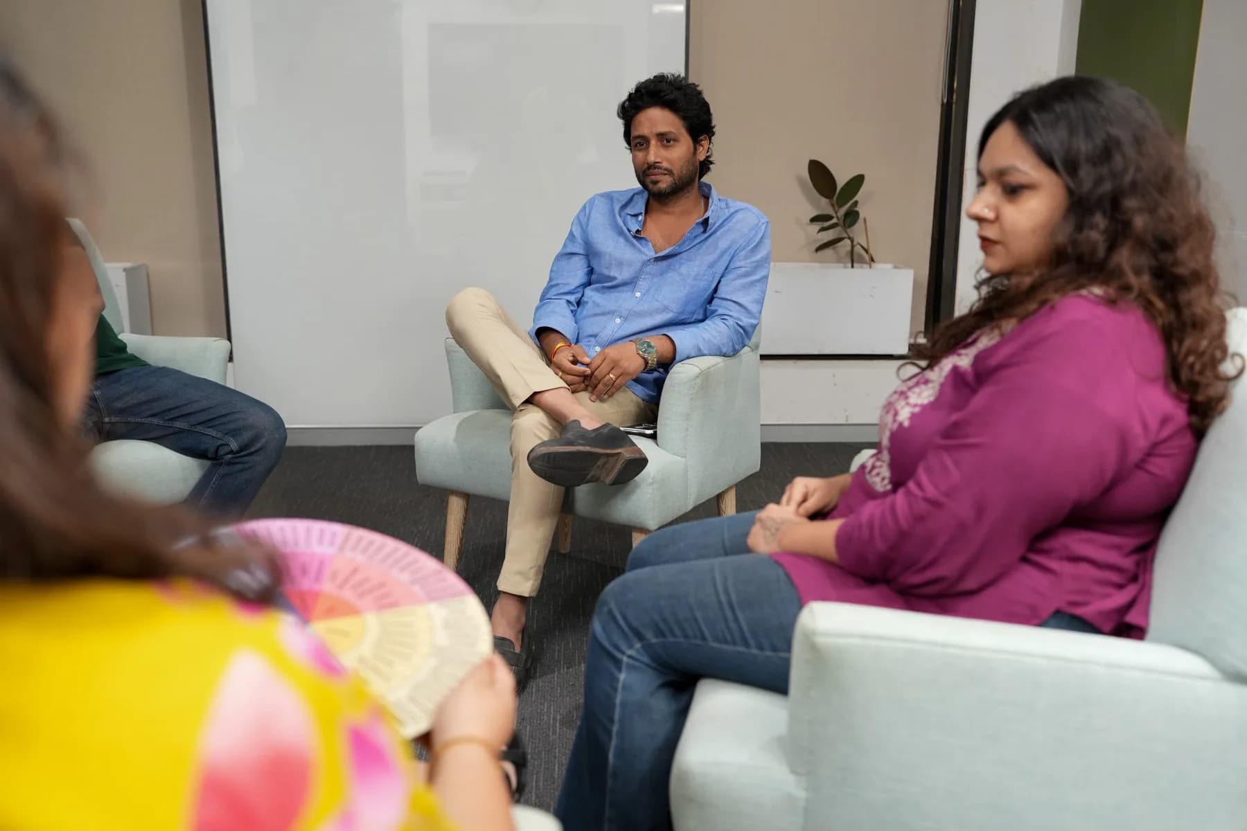 Participants listening as someone speaks