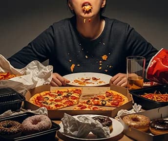 Understanding Compulsive Overeating: Symptoms, Causes & Treatment